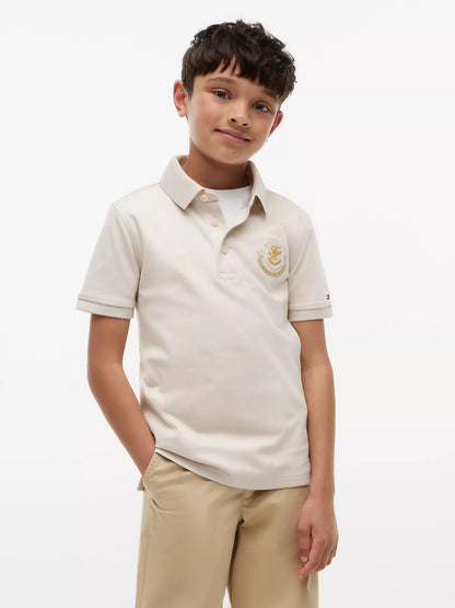 Polo infantil con logo de escudo